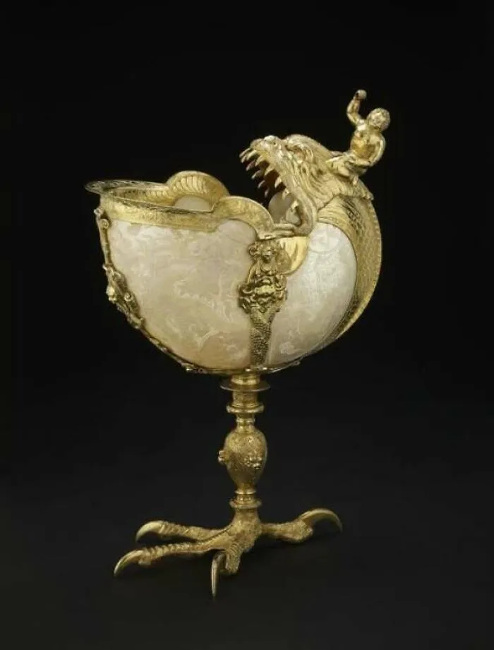 Ornate historical drinking vessel shaped like a dragon with gold detailing