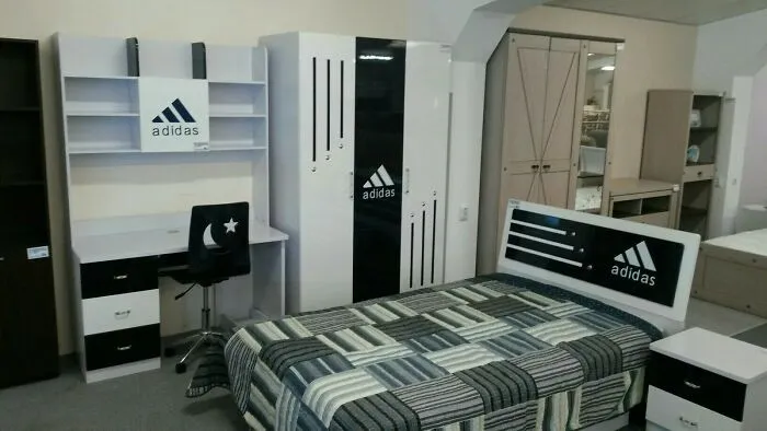 Bedroom furniture set decorated with Adidas branding displaying creative Slavic engineering.