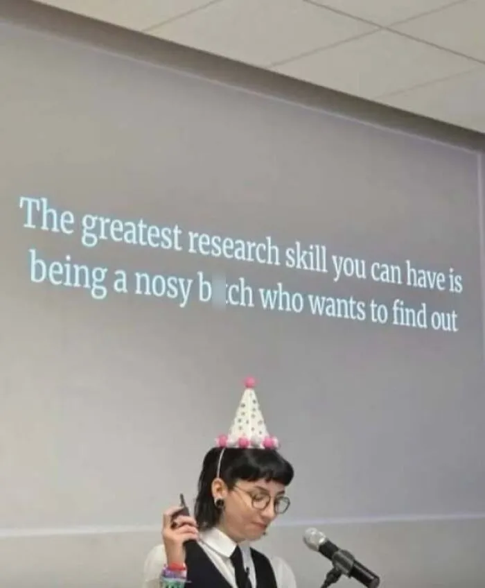 Person giving a presentation on research skills with humorous slide