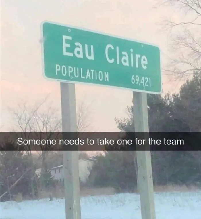 Road sign for Eau Claire with funny caption about taking one for the team