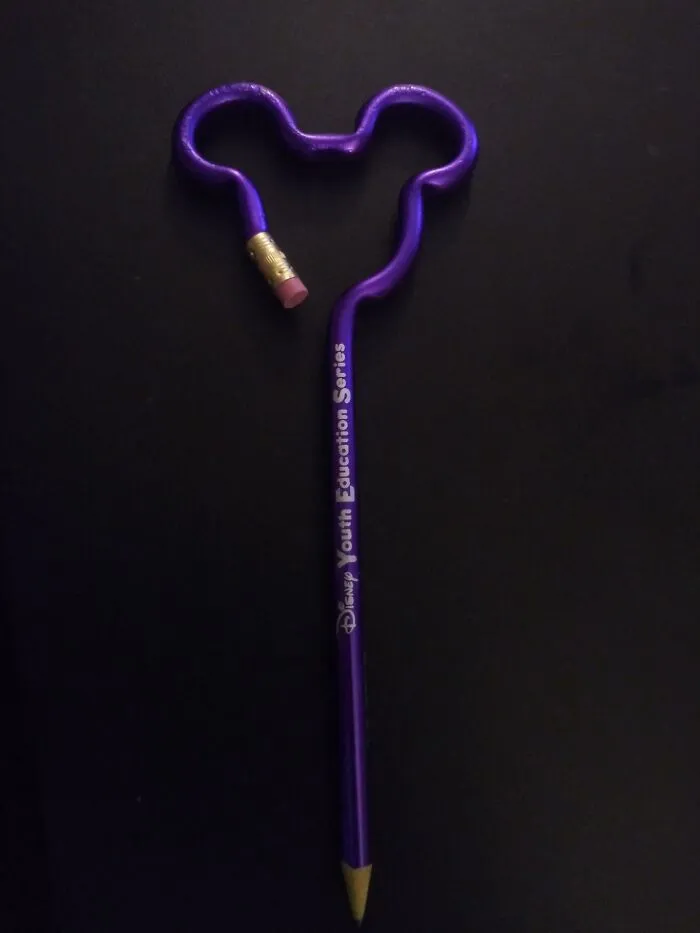 Purple pencil bent into Mickey Mouse shape for ridiculous design choices