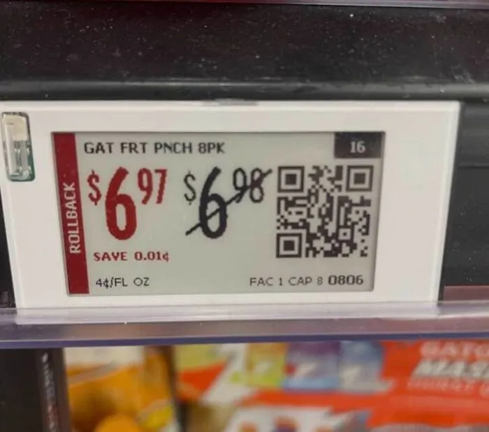 Cursed image of a store price tag showing rollback price with original price barely lower