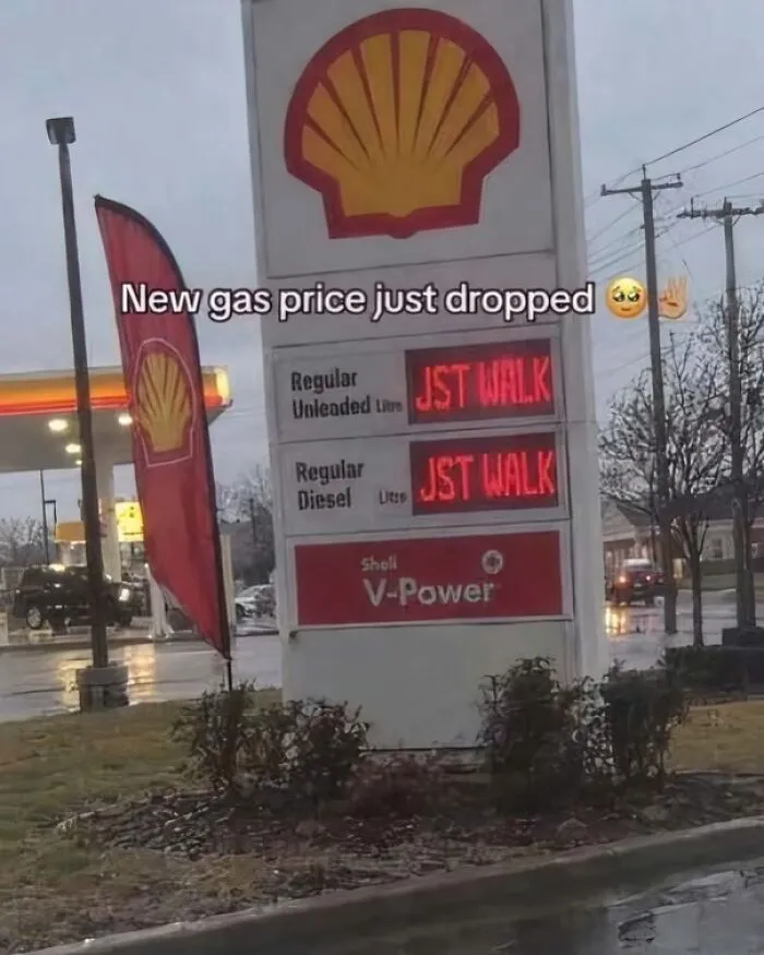 Strange pics of a Shell gas station sign displaying JST WALK as the price.