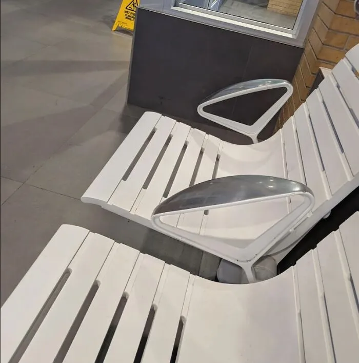 White metal chairs with uncomfortable metal armrests