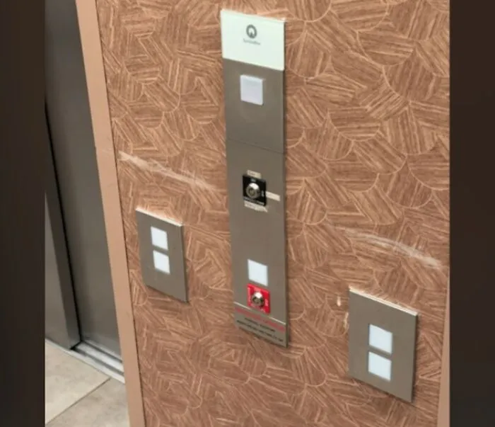 Elevator control panel with confusing multiple button layout