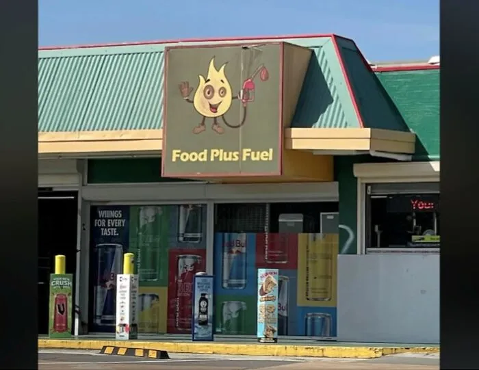 Food Plus Fuel convenience store sign with cartoon flame mascot design error