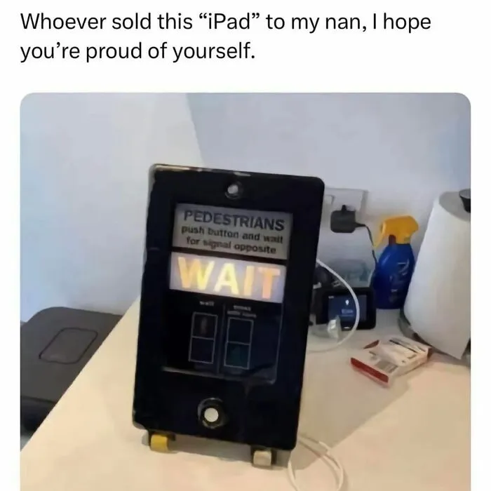 Pedestrian crossing button humorously mistaken for an iPad in British dry humor joke