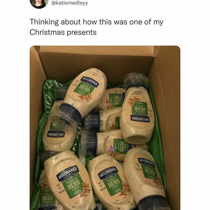 Social media post showing box full of Hellmann's garlic herb sauce bottles as a funny Christmas present