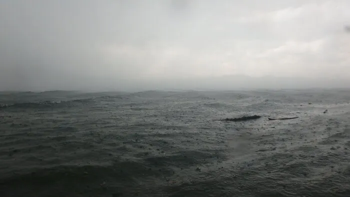 Stormy deep-water sea under gray cloudy sky
