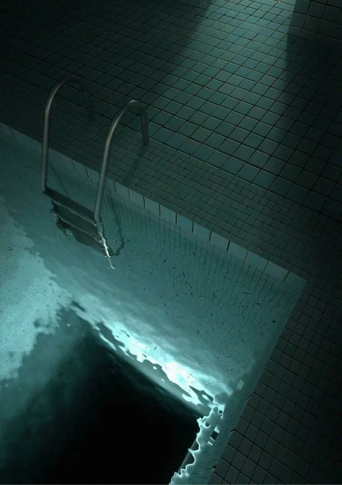 Dark indoor pool with eerie deep water and floating ladder