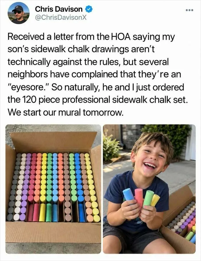 A happy young boy holding colorful chalk, featured in fun posts about sidewalk art.