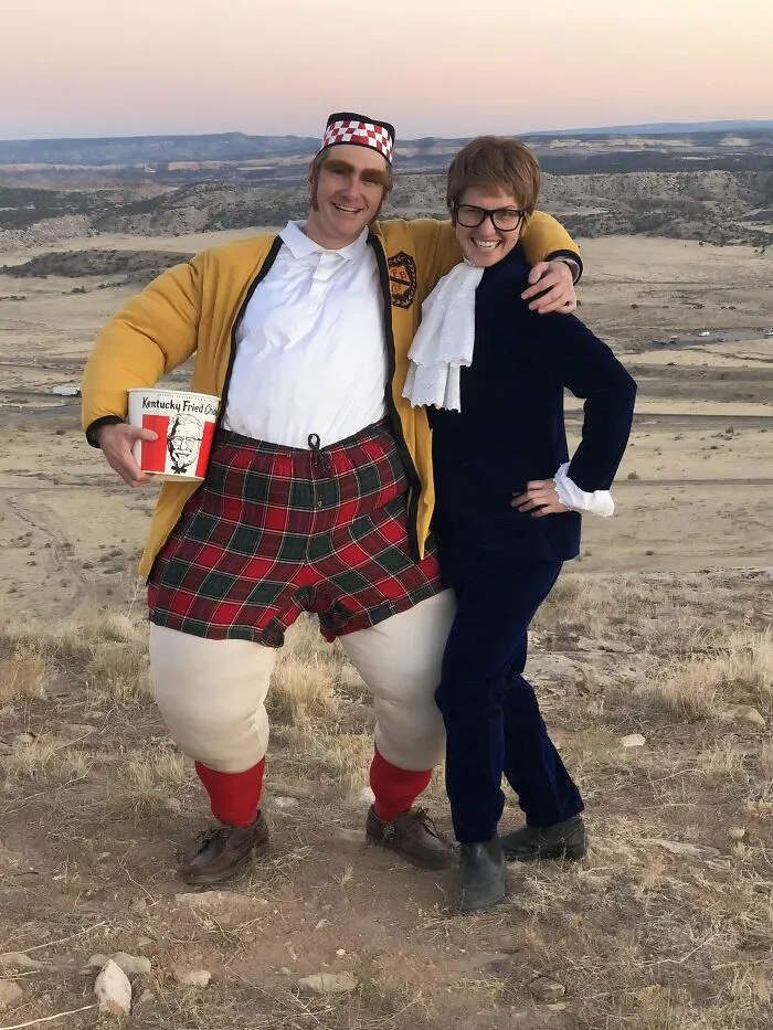 Couple posing in movie character costumes for funny cool Halloween couples costumes.