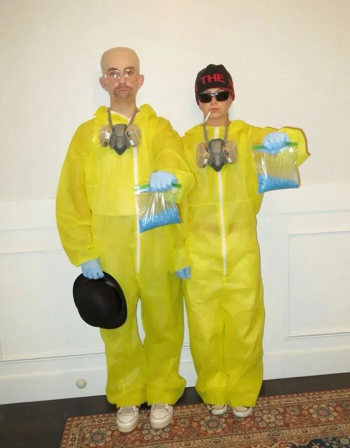 Breaking Bad themed funny Halloween couples costumes featuring yellow hazmat suits and blue candy.