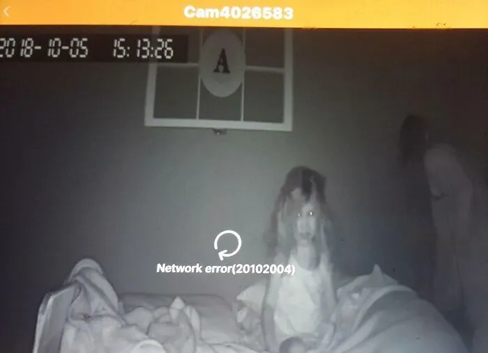 Eerie night-vision camera footage of a child in bed looking like a scene straight out of a horror movie