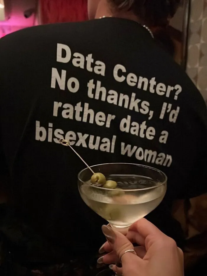 Person wearing a graphic t-shirt with a funny statement about data centers and dating.