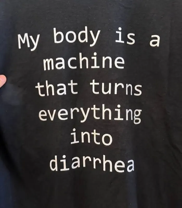 Black hilarious T-shirt printed with unexpected humor text reading My body is a machine that turns everything into diarrhea