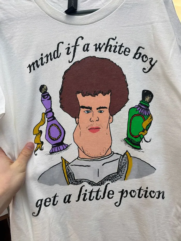 Hilarious T-shirt with cartoon illustration and unexpected text asking mind if a white boy get a little potion