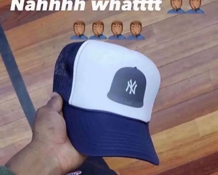 A trucker hat printed with a picture of another hat, an example of absurd internet posts.