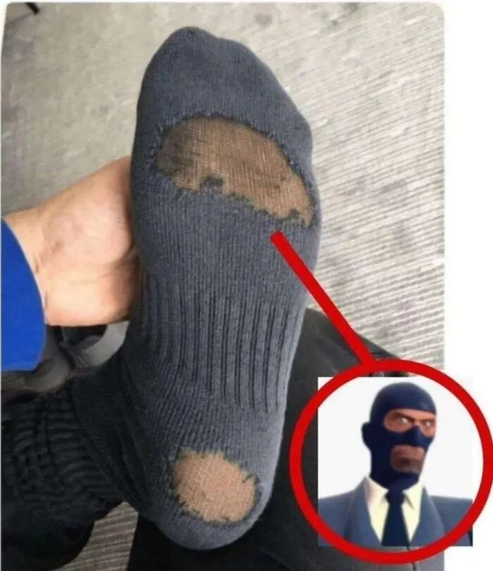 A sock with holes that resembles a character mask as seen in absurd internet posts.