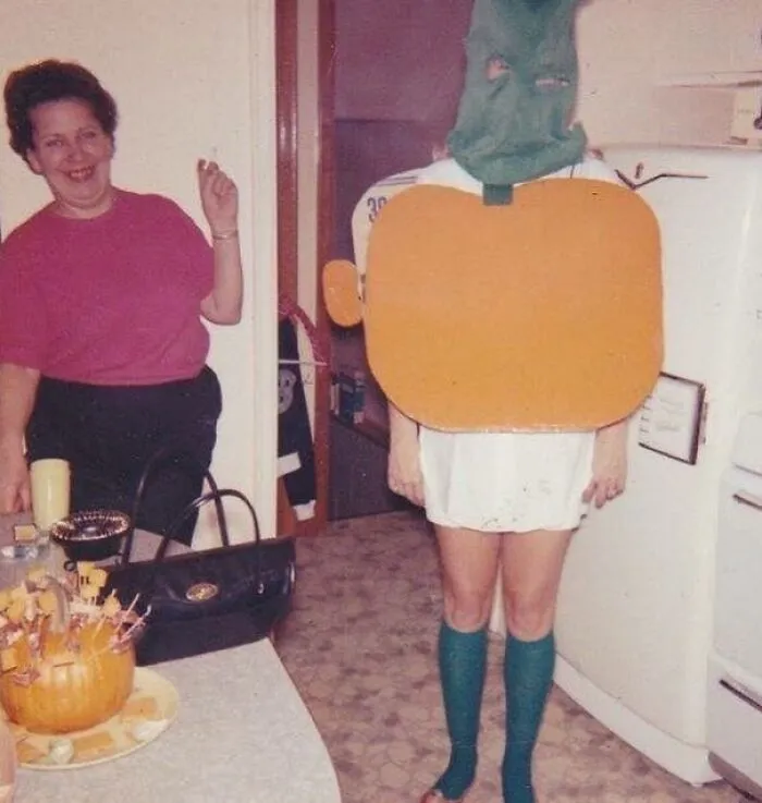 Awkward homemade pumpkin Halloween costume fail in kitchen