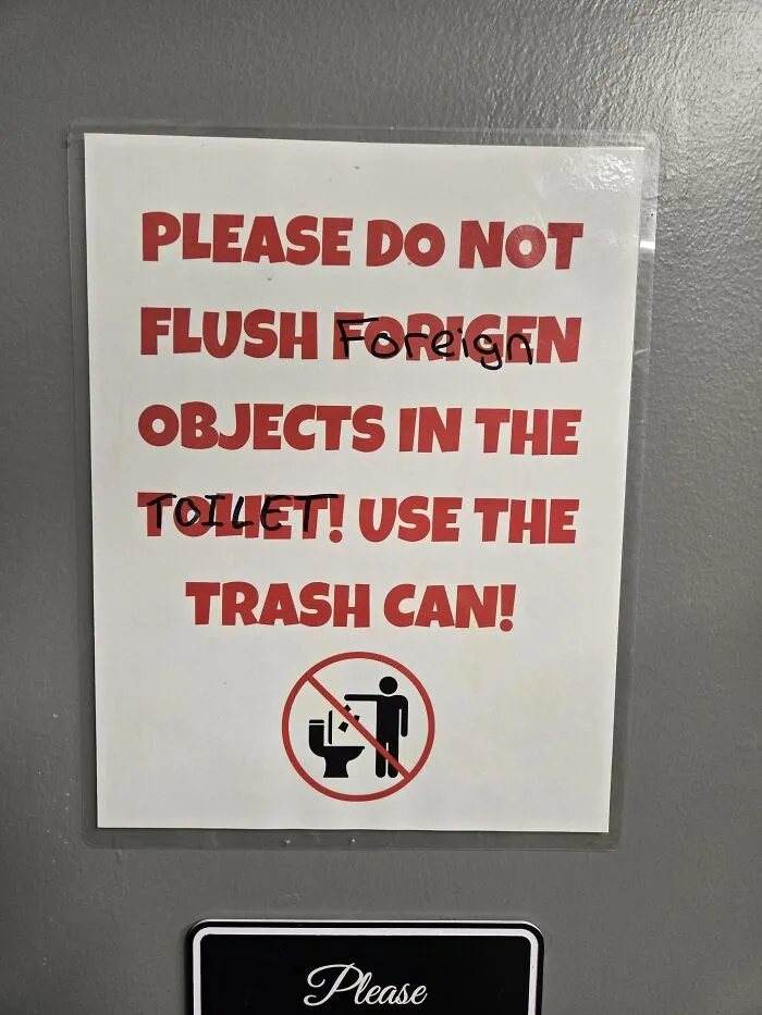 Funny sign with spelling fails correcting foreigen and toilet with handwritten marker.