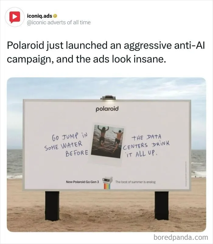A Polaroid billboard campaign featured in iconic ads highlighting anti-AI messaging on a beach.
