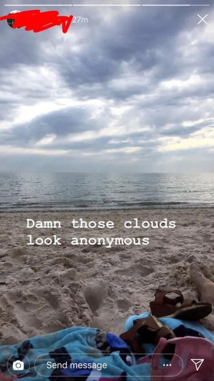 A beach photo with text showing spelling fails using anonymous instead of ominous.