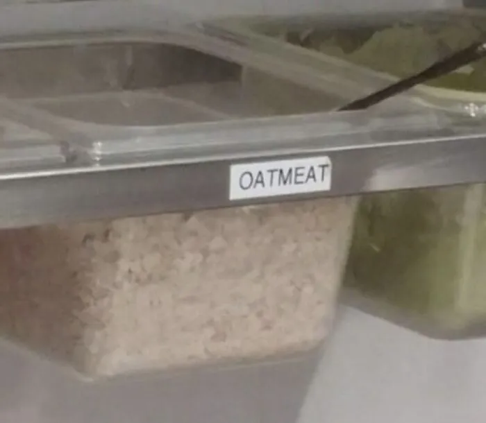 A restaurant food container labeled OATMEAT, an amusing spelling fail