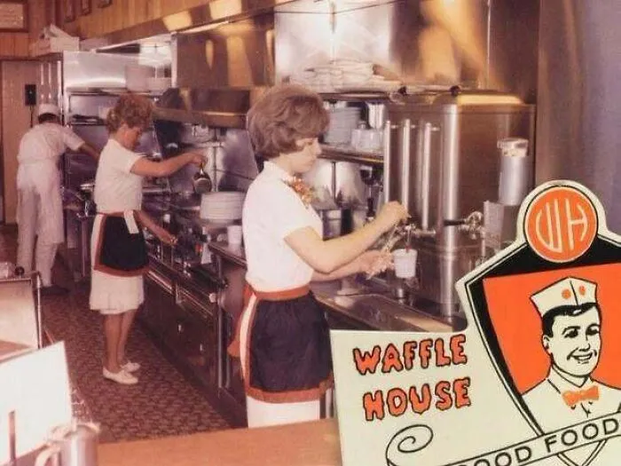 Charming classic scene of staff working inside a vintage Waffle House, featured in old photos of America.