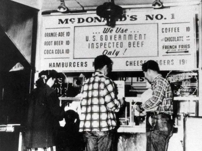 Old photo of early McDonalds fast food restaurant menu and counter in America