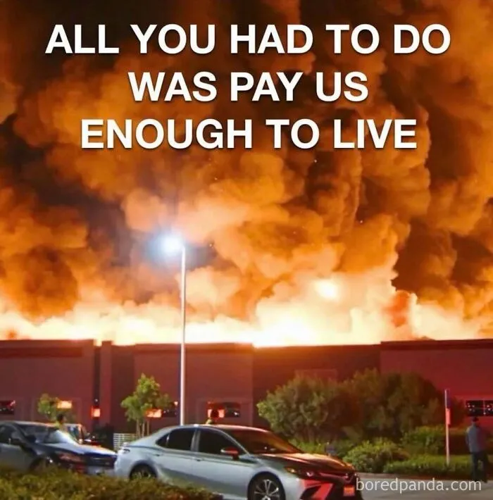 Large building engulfed in flames with text overlay representing commentary in dark dystopian memes.