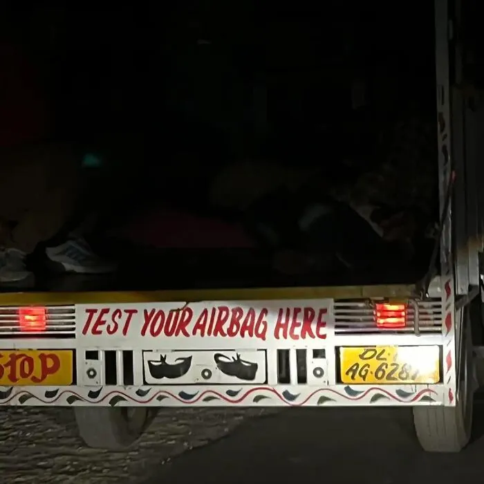 Funny bumper sticker on a truck bumper saying TEST YOUR AIRBAG HERE
