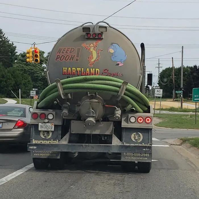 Septic tank truck featuring Tigger and Eeyore with a funny sign reading Need Pooh! as a truckers moving joke