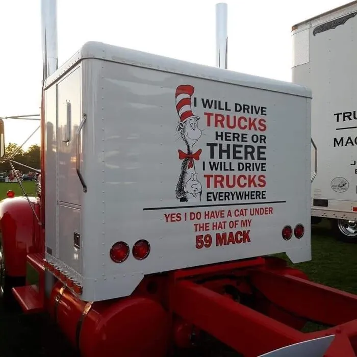 Custom red and white Mack semi truck featuring Dr. Seuss Cat in the Hat artwork and poetry.