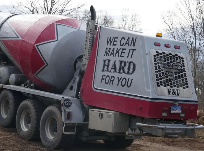 Back of a cement mixer truck featuring double entendre humor