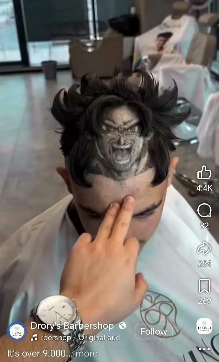 An elaborate haircut featuring an anime character face buzzcut, showcasing awful creations in hair art.