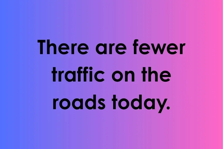 Sentence testing if the word fewer is used correctly regarding traffic on a colorful background.
