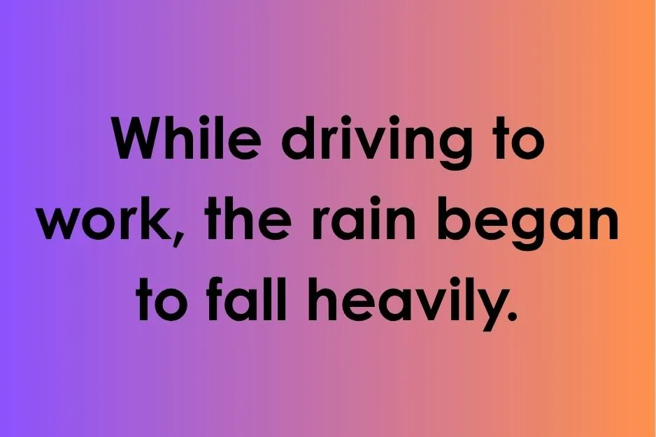 Dangling modifier example showing a sentence about rain falling heavily while driving to work.