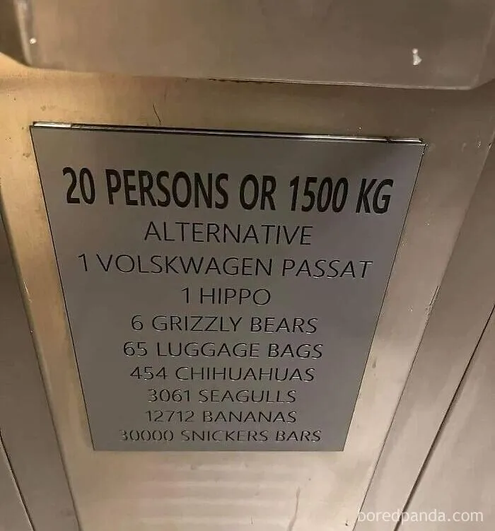 An elevator plaque listing absurd weight limits like 1 hippo or 30000 Snickers bars instead of the metric system.
