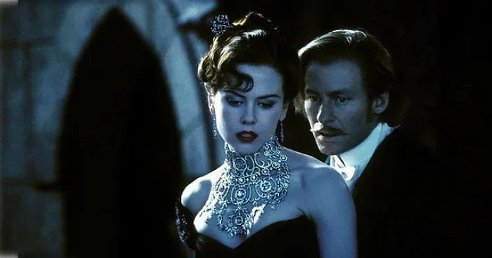 Nicole Kidman wearing a stunning diamond necklace, a beautiful example of detailed movie props.