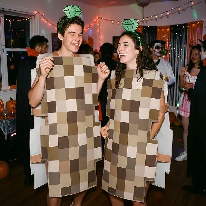 A couple dressed in pixelated censorship suits for creative and low-effort Halloween costumes.