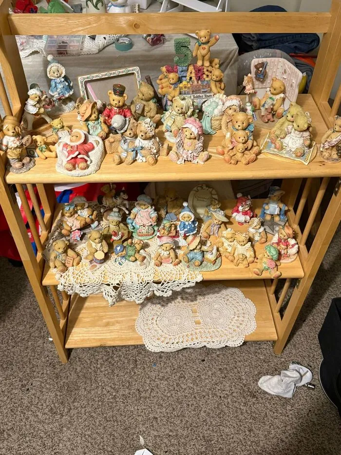 Wooden shelf filled with vintage teddy bear figurines thrift store finds