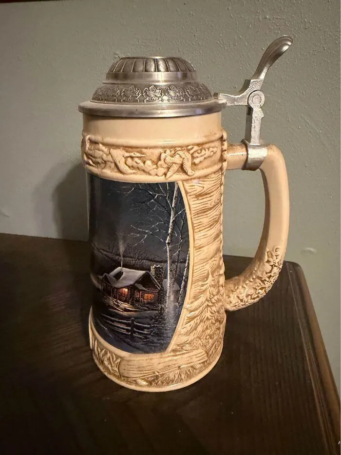 Antique ceramic beer stein with a winter cabin scene thrift find