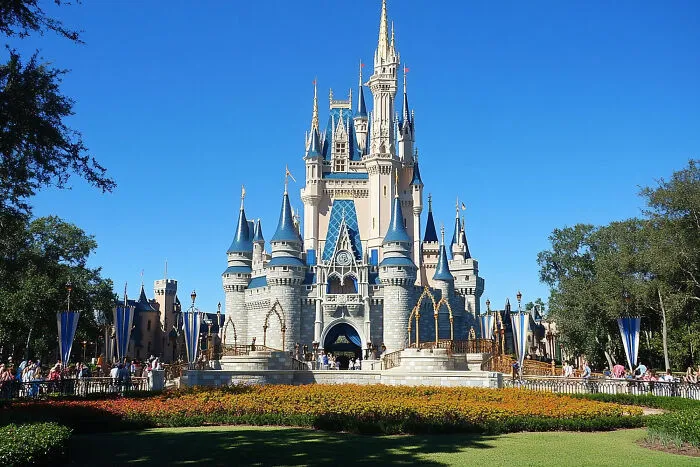 Fairytale castle under a clear sky, contrasting ideal romance with painful divorce stories.