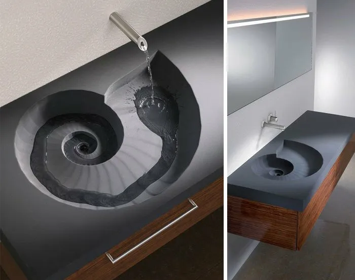 Unique interior design decision showing a spiral shell shaped sink with water flowing down the groove