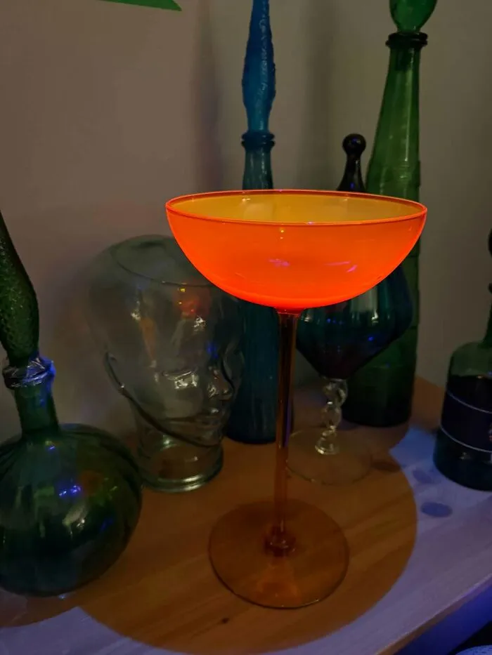 Glowing orange cadmium glass goblet, an eye-catching thrift find.