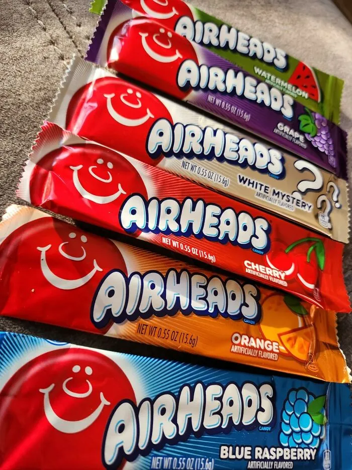 A stack of colorful Airheads fruit-flavored candy bars, top choices for Halloween candies fans