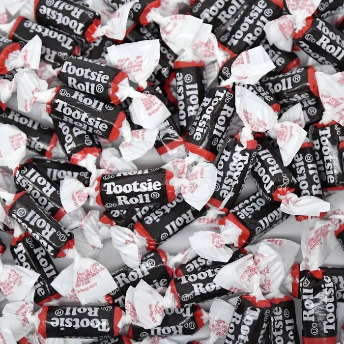 A pile of individually wrapped bite-sized Tootsie Roll candies for Halloween trick-or-treating