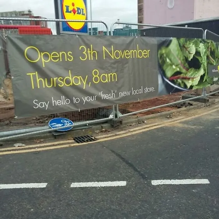 An outdoor banner displaying misused quotation marks around the word fresh.