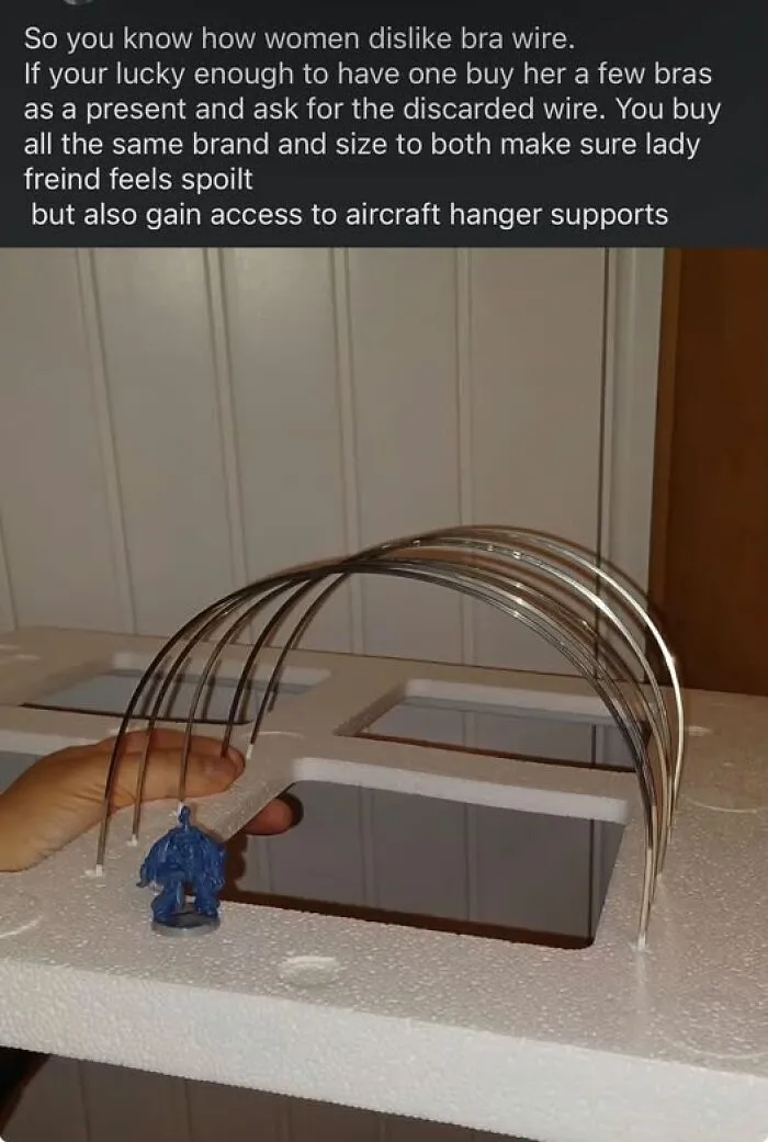 A miniature aircraft hangar support made of bra underwires as a funny diy craft project.